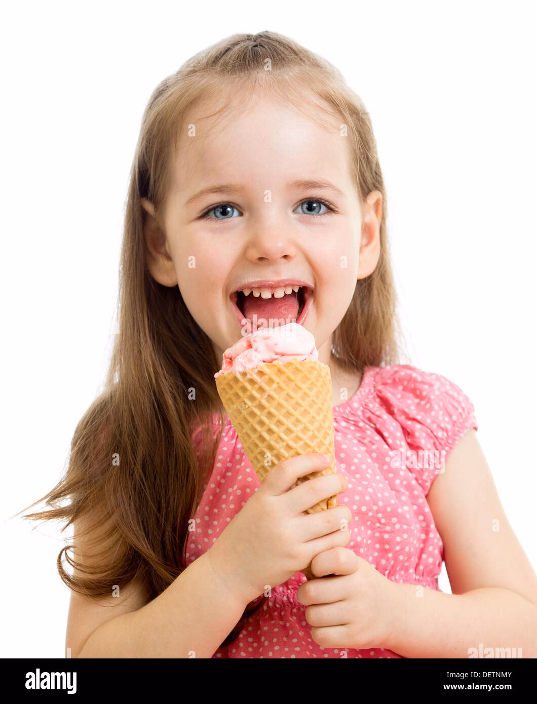 What is a happy little girl eating in the images?