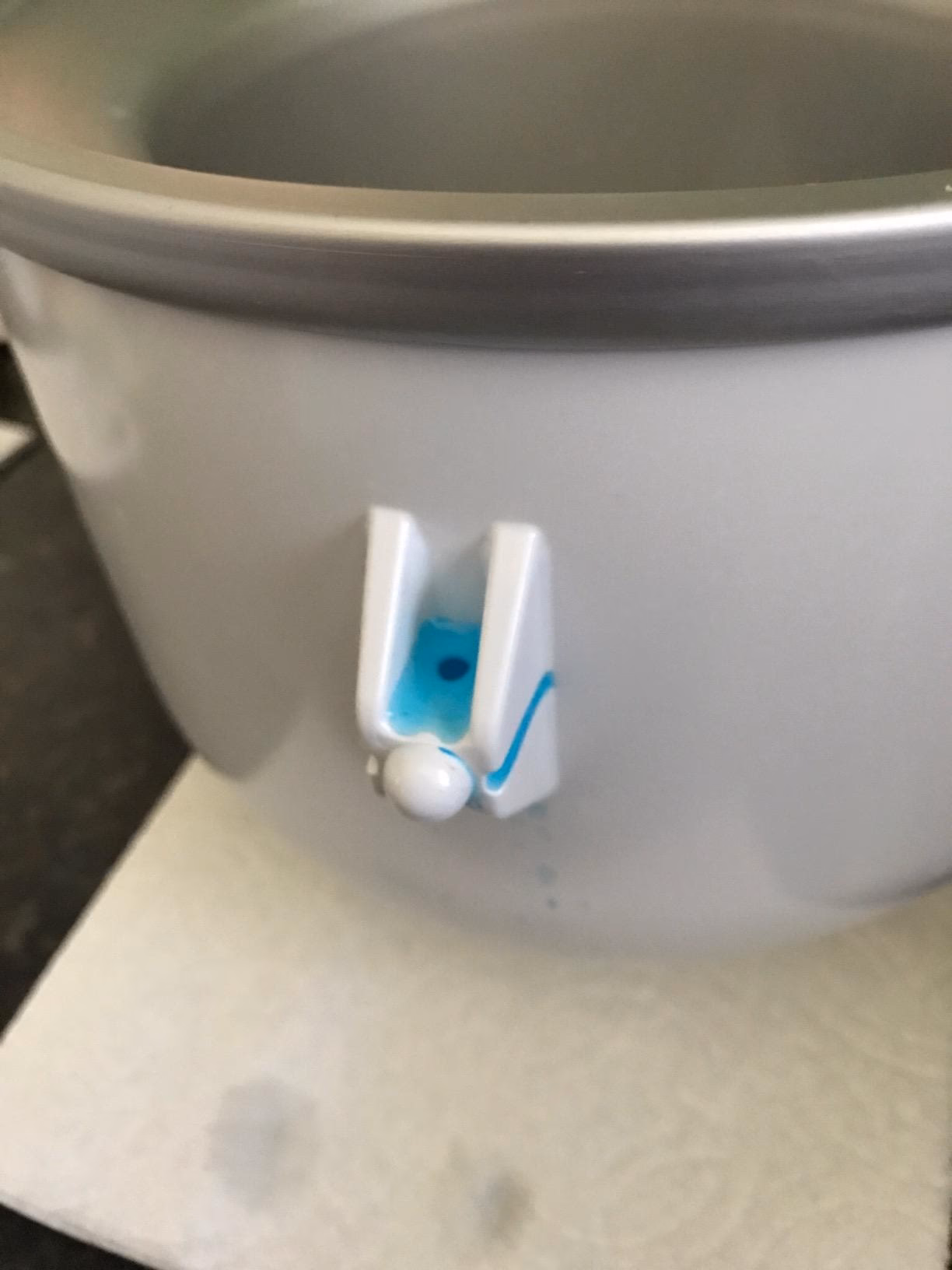 Why is my KitchenAid ice cream maker leaking?