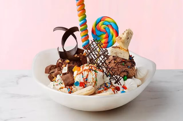 Does Norwegian's free at sea offer free specialty dining?